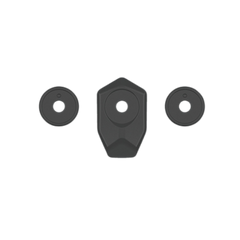 Three black rubber grommets on a white background