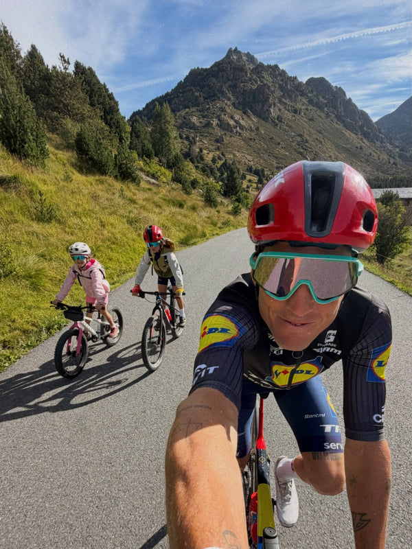 Cycling on a mountain road with two children riding behind