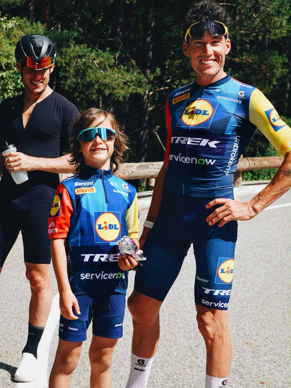 Three cyclists in Lidl-Trek kit posing on a road