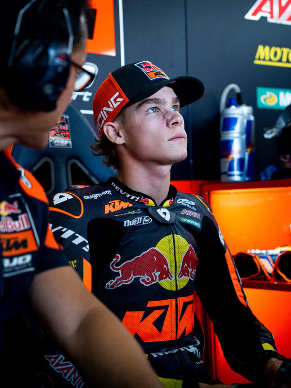 Red Bull KTM rider in the garage wearing a headset