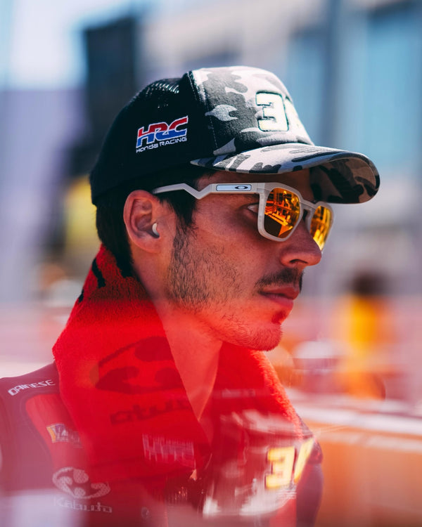 Joan Mir in an HRC cap and mirrored sunglasses