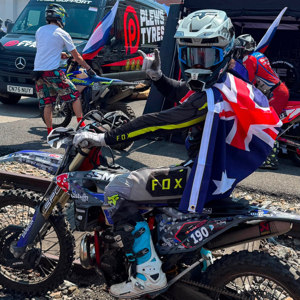 Enduro rider with an Australian flag on his bike