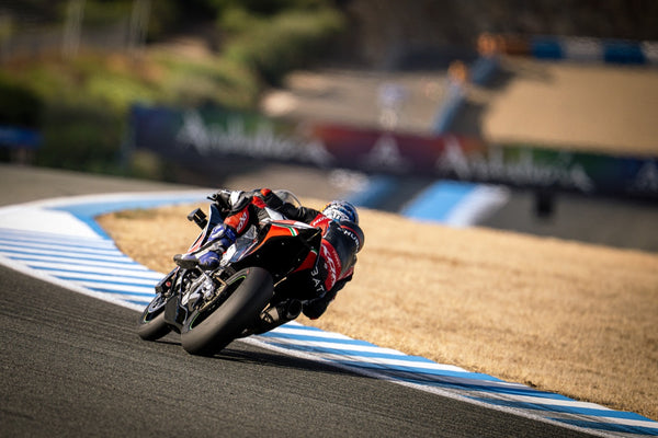 Rider cornering on a Bimota superbike
