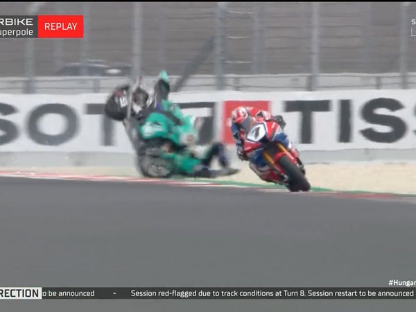 Race bikes in a crash, with a red-flag message on screen